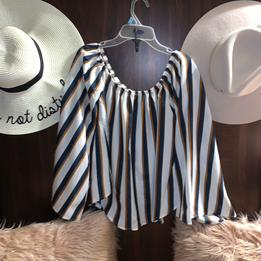 Flare arms off the shoulder top.